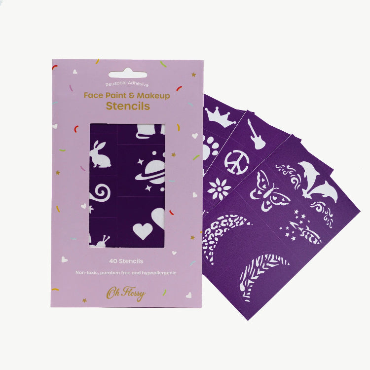Purple face paint and makeup stencils with packaging on a white background