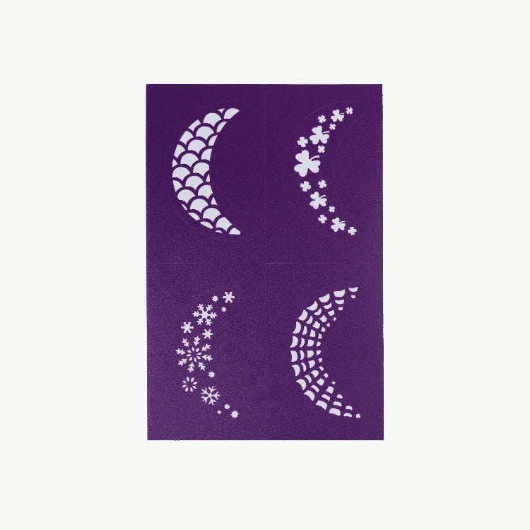 Four white crescent moon and floral designs on a purple card