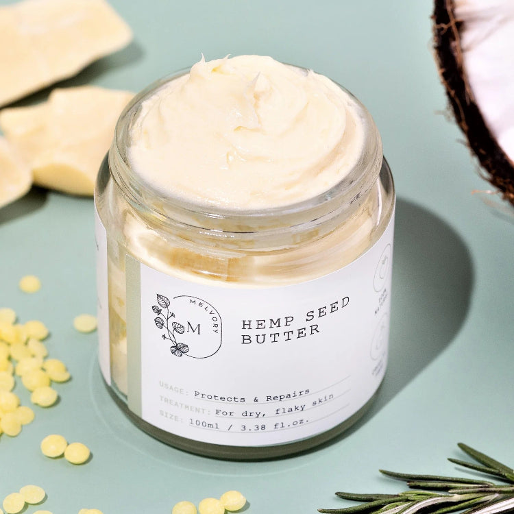 Jar of hemp seed butter with a label on a light blue background