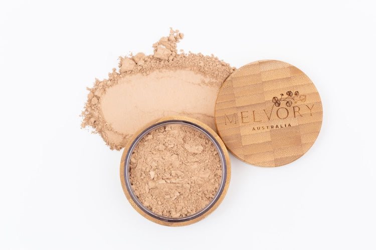 Melvory's natural mineral powder foundation with SPF 15. Warm honey shade in loose powder.