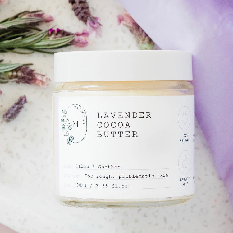 Jar of lavender cocoa butter product with a white background
